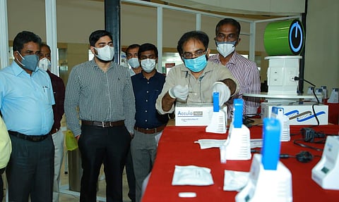 CIAL Managing Director S Suhas reviews the Rapid-PCR testing centre set up at Terminal-3 (Photo | Special arrangement)