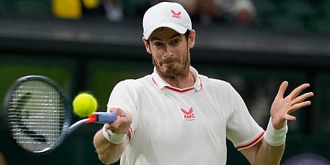 Andy Murray returns the ball to Nikoloz Basilashvili during the men's singles match on day one of the Wimbledon Tennis Championships in London. (Photo | AP)