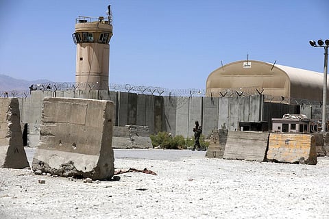 An Afghan Army soldier walks at the gate of Bagram Air Base in Afghanistan. (Photo | AP)