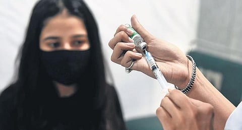 A healthcare worker administers Covid vaccine on Wednesday. (Photo | EPS/Parveen Negi)