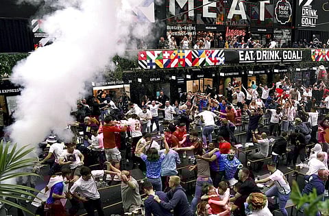 Fans celebrate as they watch the Euro 2020 round of 16 match between England and Germany at BOXPARK Croydon, south London. (Photo | AP)
