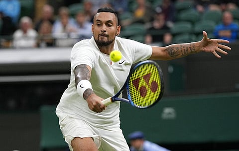 Australia's Nick Kyrgios plays a return to Ugo Humbert of France during the men's singles first round match on day two of the Wimbledon. (Photo | AP)