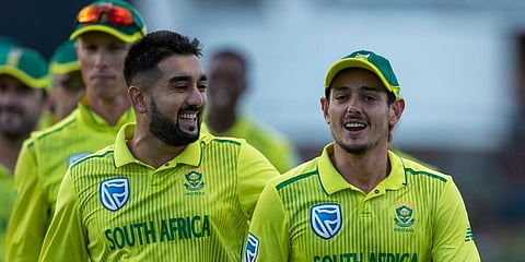 South Africa's bowler Tabraiz Shamsi, left, and captain Quinton de Kock leave the field. (Photo | AP)