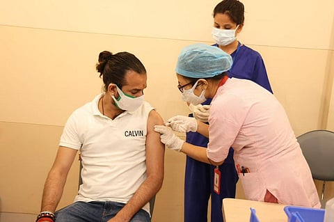 Tej Pratap Yadav being administered Sputnik V vaccine. (Photo | Tej Pratap Yadav, Twitter)