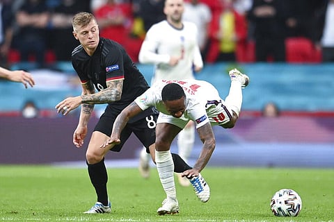 Germany's Toni Kroos challenges England's Raheem Sterling, right, during the Euro 2020 soccer championship round of 16 match between England and Germany. (Photo | AP)