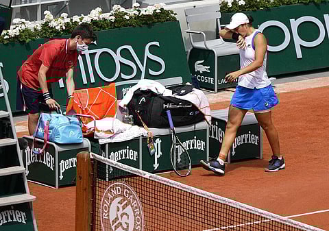 Australia's Ashleigh Barty walks back on to the the court from medical time out as she was playing against Poland's Magda Linette. (Photo | AP)
