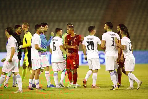Belgium's Youri Tielemans, center, shakes hands with Greece's Kostas Galanopoulos, center left, and Greece's Petros Mantalos, center right, at the end of the friendly match. (Photo | AP)