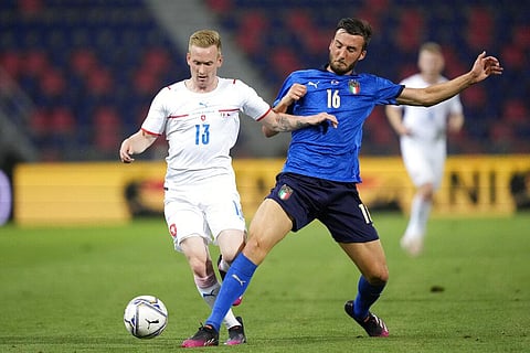 Czech Republic's Petr Sevcik, left, is challenged by Italy's Bryan Cristante during the international friendly soccer match between Italy and Czech Republic in Bologna. (Photo | AP)