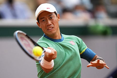 Japan's Kei Nishikori plays a return to Switzerland's Henri Laakosonen during their third round match on day 6, of the French Open. (Photo | AP)