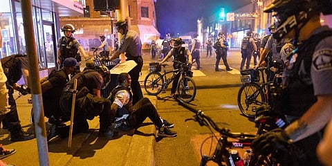 Protesters are arrested by police after a vigil was held for Winston Boogie Smith Jr. early on Saturday, June 5, 2021. (Photo | AP)z
