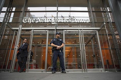 In this June 28, 2018, file photo, a police officer stands outside The New York Times building in New York. (Photo | AP)