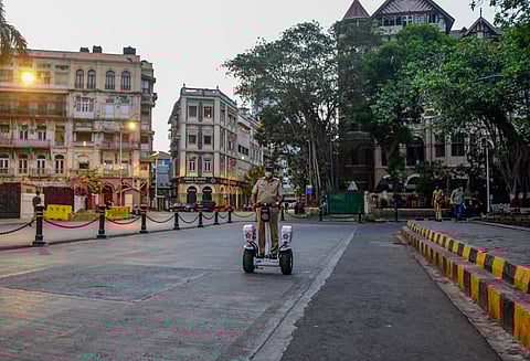 A police personnel patrols near the Gateway of India area in Mumbai (File photo | PTI)
