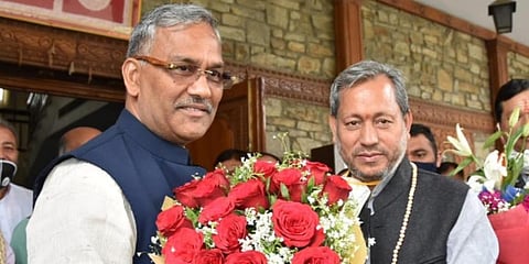 Former Uttarakhand CM Trivendra Singh Rawat meets incumbent Tirath Singh Rawat. (Photo| EPS)