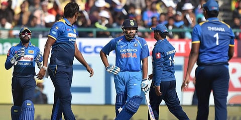 Sri Lanka's Suranga Lakmal and his teammates look on as Rohit Sharma waits for 3rd umpire'a decision on his dismissal during an ODI match. (File photo| PTI)