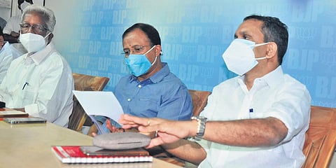 BJP state president K Surendran addressing the media prior to the core committee meeting in Kochi on Sunday. Union Minister V Muraleedharan and former state presidents Kummanam Rajashekharan and P K K