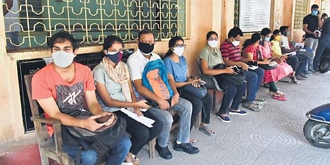 Students travelling abroad wait for their turn to get vaccinated at an international vaccination centre, in Hyderabad. 
(Image used for representational purposes only)
