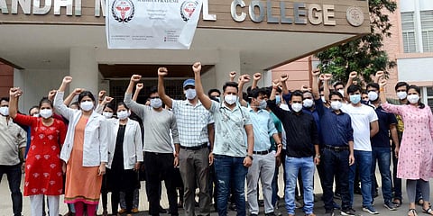 Junior doctors demonstrate during their indefinite strike for the fulfillment of demands in Bhopal. (Photo| ANI)