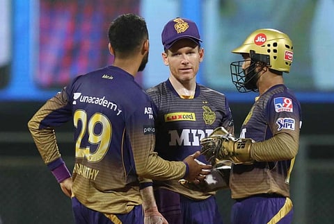 Eoin Morgan captain of Kolkata Knight Riders with Varun Chakaravarthy and Dinesh Karthik . (Photo | IPL)