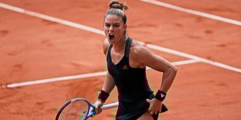 Maria Sakkari of Greece reacts as she plays Poland's Iga Swiątek during their quarterfinal match of the French Open tennis tournament at the Roland Garros stadium. (Photo| AP)