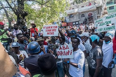 Haitians protesters march through the streets on of Port-au-Prince, to denounce the upsurge in kidnappings committed by gangs (Photo | AFP)