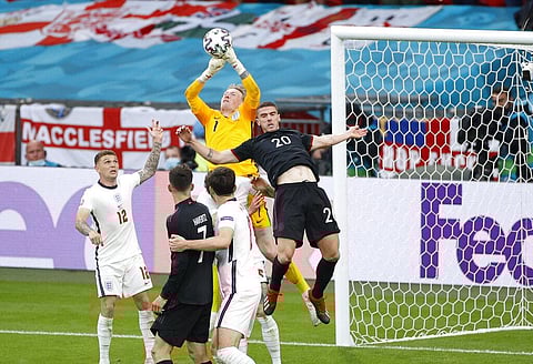 England's goalkeeper Jordan Pickford, center, makes a save in front of Germany's Robin Gosens, right, during the Euro 2020 soccer match round of 16. (Photo | AP)