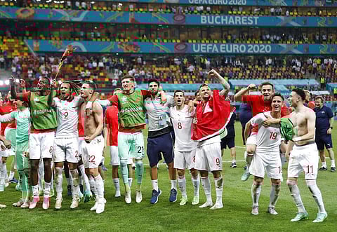 Players of Switzerland celebrate winning the Euro 2020 soccer championship round of 16 match between France and Switzerland at the National Arena stadium in Bucharest. (Photo | AP)