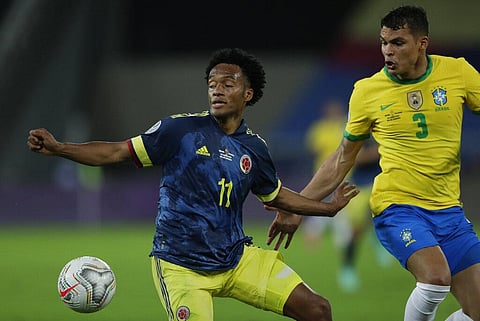 Colombia's Juan Cuadrado, left, and Brazil's Thiago Silva battle for the ball during a Copa America soccer match at Nilton Santos stadium in Rio de Janeiro. (Photo | AP)