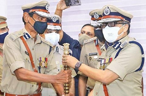 Outgoing state police chief Loknath Behera handing over the ceremonial baton to new  chief Anil Kant (L) on Wednesday | Express