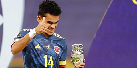 Colombia's Luis Diaz holds the best player of the match trophy after beating 3-2 Peru in the Copa America third place match. (Photo | AP)