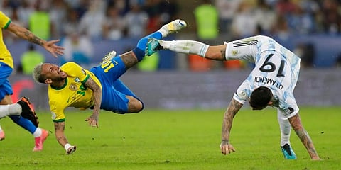 Brazil's Neymar, left, and Argentina's Nicolas Otamendi fall to the ground during the Copa America final soccer match at the Maracana stadium on Saturday, July 10, 2021. (Photo | AP)