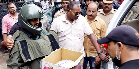 Suspicious material being brought out of a house at Kakori's Dubagga area where terror suspects are hiding, in Lucknow on Sunday. (Photo | ANI)