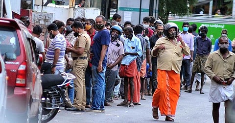 File photo of a long queue in front of the liquor outlet at High Court Junction in Kochi. (Photo | A Sanesh, EPS)