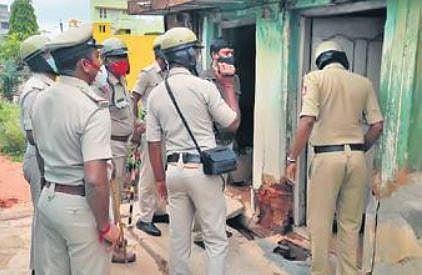 Police at the home of a rowdy-sheeter.