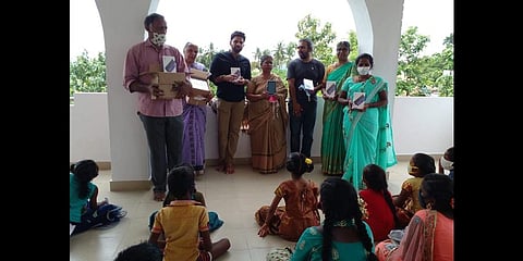 Canada-based entrepreneur Vijay Sappani, who is currently in Chennai, visited Thirukandalam and handed over the devices to NGO Anbagam. (Photo | Express)