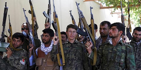 Militiamen loyal to Ata Mohammad Noor, chief of Jamiat-e-Islami and a powerful northern warlord, stand guard at their office in Mazar-e-Sharif north of Kabul, Afghanistan. (Photo | AP)