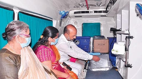 BJP State president and Karimnagar MP Bandi Sanjay Kumar, along with his wife and mother, sit inside an ambulance he donated in Karimangar on Sunday, July 11, 2021. (Photo | Express)