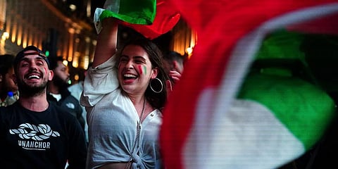 Italy fans celebrate in Piccadilly Circus in central London after their team won the UEFA Euro 2020 Final against England. (Photo | AP)