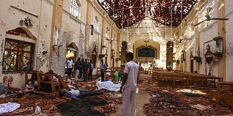Dead bodies of victims lie inside St. Sebastian's Church damaged in blast in Negombo, north of Colombo, Sri Lanka. (Photo | AP)
