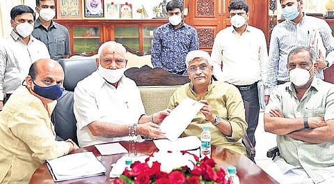 Chief Minister B S Yediyurappa with Union Minister Gajendra Singh Shekhawat during the review meeting at Vidhana Soudha in Bengaluru on Tuesday | Express