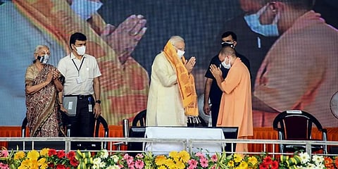 PM Narendra Modi, UP CM Yogi Adityanath and Governor Anandiben Patel during inauguration of various developmental projects, at BHU Ground in Varanasi. (Photo | PTI)