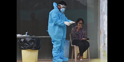 Medical staff conducting COVID test. (File Photo | P Ravindra Babu, EPS)