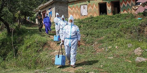 Primary health officials being escorted and facilitated by Indian Army jawans for door-to-door vaccination against Covid-19, in the remotest forward villages near LoC in Jammu. (Photo | PTI)