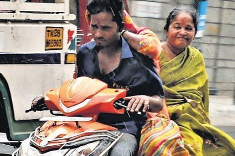 File photo of a two-wheeler rider violating several traffic rules | Express
