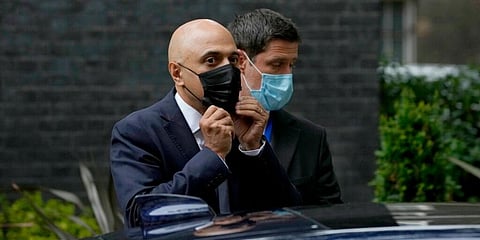 UK's France curbs irk travellers; health chief tests positive