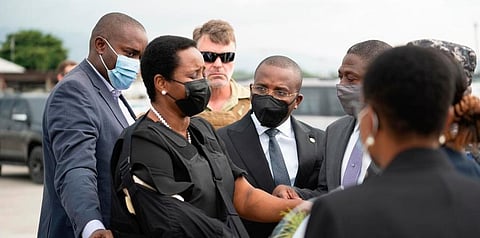 Haiti's first lady Martine Moise, wearing a bullet proof vest and her right arm in a sling, arrives at Port-au-Prince, Haiti, Saturday, July 17, 2021. (Photo | AP