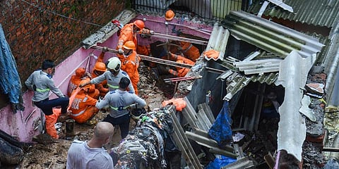 Firemen and rescue workers after a landslide in Vikroli area, in Mumbai. (Photo | PTI)