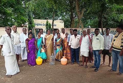 People of fluoride-hit villages throng the Sathya Sai Drinking Water Scheme in Anantapur district on Sunday, July 18, 2021. (Photo | Express)