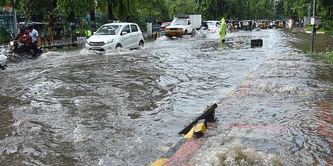 DRF staffers control traffic on a flooded Raj Bhavan Road (Photo | RVK Rao, EPS)
