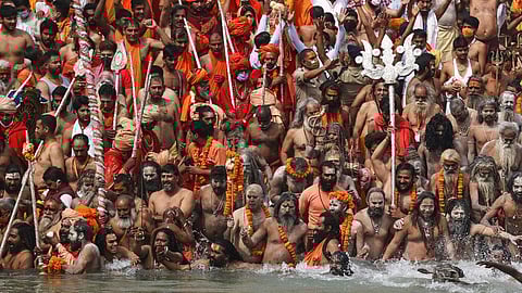 Pilgrims take a dip duringh the Mahakumbh festival.