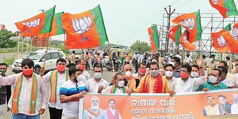 BJP members protest over paddy sale, at Dhauli Square near Bhubaneswar. (Photo | EPS)